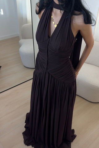 Elegant brown evening dress with a flowing silhouette, photographed on a model